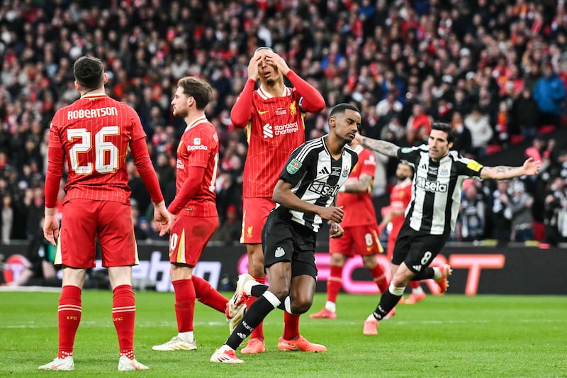 Alexander Isak scores Newcastle United's second goal as Liverpool defender Virgil van Dijk reacts during the Carabao Cup final at Wembley Stadium. Photograph: Glyn Kirk/AFP via Getty Images          