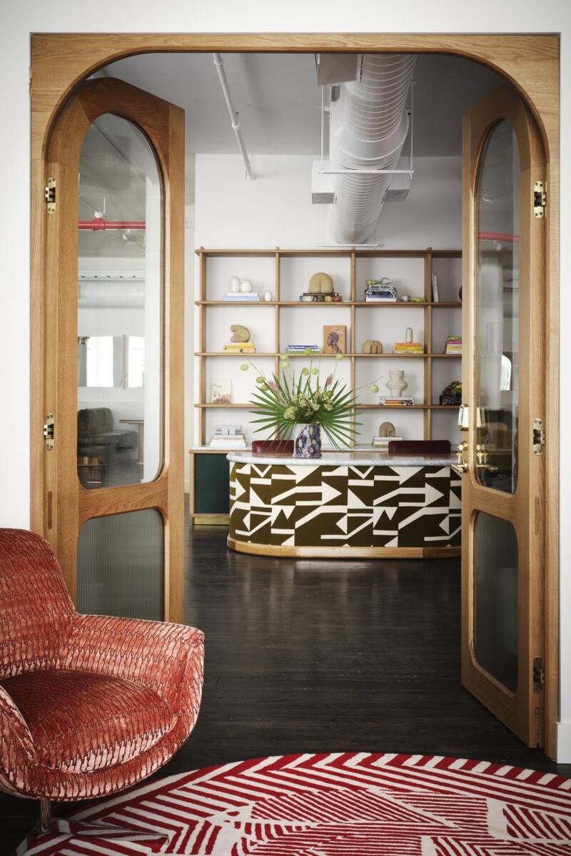 Malin entrance on the third floor: solid oak doors, rug by Katie Ann McGuigan, Pop chair by Orior. Entrance desk upholstered in Pierre Frey fabric. Photograph: Thomas Loof