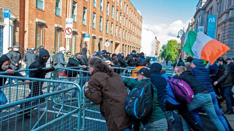 Counter-demonstrators (left) clash with activists protesting against Covid-19  restrictions in Dublin on Saturday. Photograph: Paul Faith/AFP via Getty