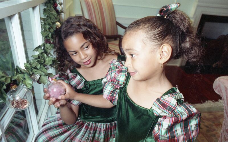 Houston childhood: Beyoncé with her sister, Solange, in 1990, when she was nine. Photograph: Paul S Howell/Houston Chronicle via Getty