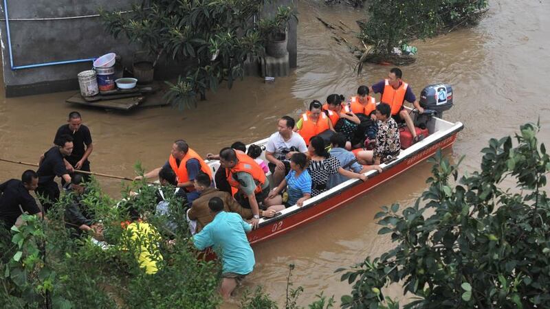 A building collapses amid floodwaters caused by torrential rain in Deyang City, Shifang County, Sichuan Province,  on Tuesday in this still image taken from video. Photograph: Reuters/CCTV via Reuters TV