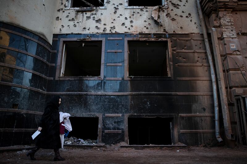 
                        FILE — A pedestrian passes the aftermath of a Jan. 16 Russian missile attack which struck a residential area and injured 17 people, in central Kharkiv, Ukraine on Jan. 17, 2024. If the United States pulls the plug on its support for the war, much of the day-to-day military necessities will go away. (Tyler Hicks/The New York Times)
                      