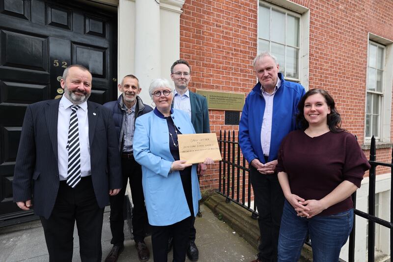 Academics Frank Jones, Kingston Mills, Jane Ohlmeyer, John Walsh, Luke O'Neill and Nicole Volmering with an open letter for Minister for Further and Higher Education Simon Harris. Photograph: Nick Bradshaw