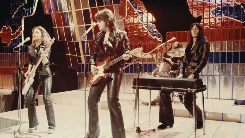 Suzi Quatro and her band on the Top of the Pops  Christmas Day edition in  1973. Photograph:  Michael Putland/Getty Images