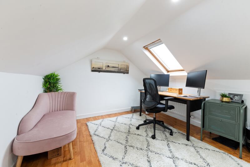 A home office occupies the converted attic