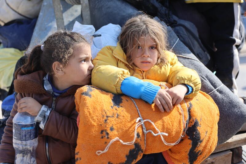 Children on a donkey cart as Palestinians displaced from shelters in Beit Hanoun cross into Jabalia in northern Gaza following Israeli army evacuation orders on November 12th, 2024. Photograph:y Omar Al-Qattaa/AFP