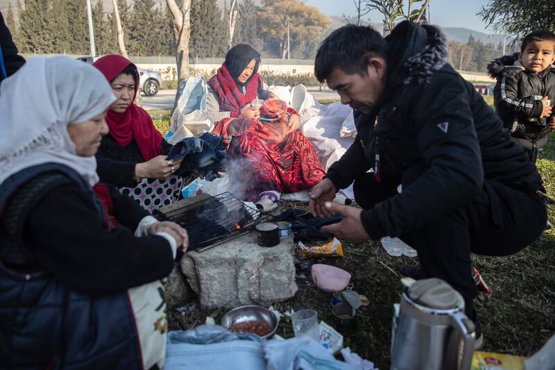 People cook in a park in Hatay, Turkey. Photograph:  Burak Kara/Getty Images