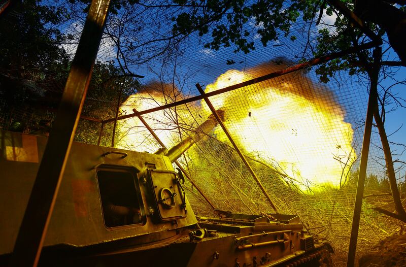 Troops from Ukraine's 30th Independent Mechanised Brigade fire  towards Bakhmut, eastern Ukraine. Photograph: EPA