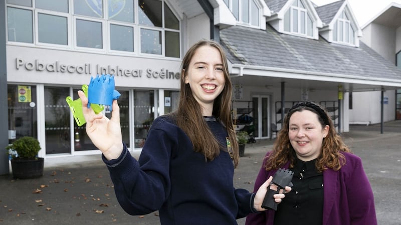 Teacher Sarah Abbott with student Ana Parkes-Young from Pobalscoil Inbhear Sceine, Kenmare, Co Kerry who is showcasing her project, a helping hand – 3D print and assemble a hand prosthetic to discover if it’s as effective as one made out of an alloy. Photograph: Fennell Photography