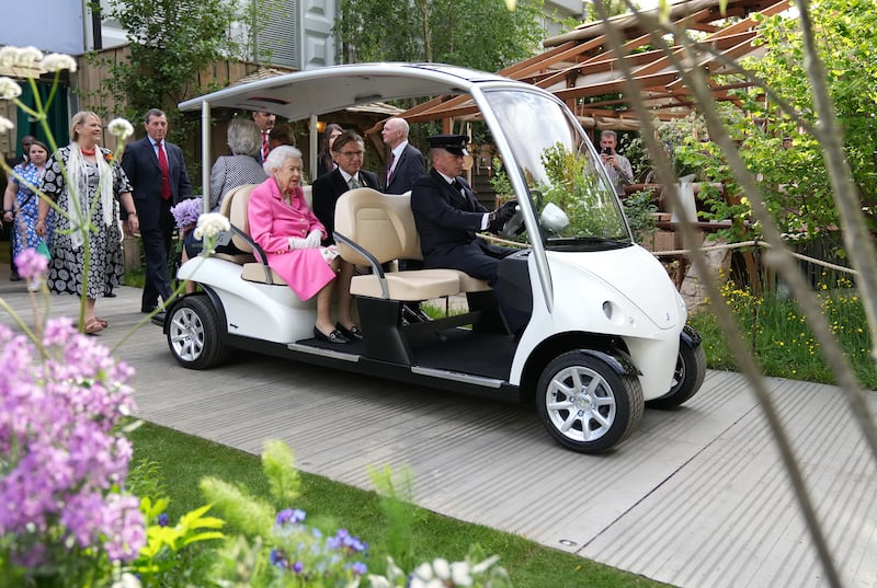 Queen Elizabeth, sitting in a buggy, during a visit to the RHS Chelsea Flower Show 2022. Photograph: James Whatling