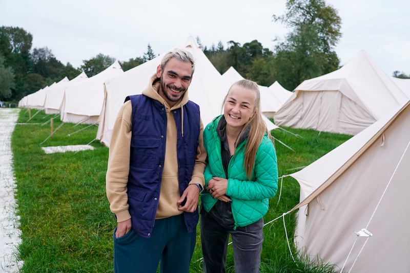 Vlad Makarenko with Katya Tolstikova, who are both staying in the tents on the Electric Picnic site in Stradbally. Photo: Enda O'Dowd