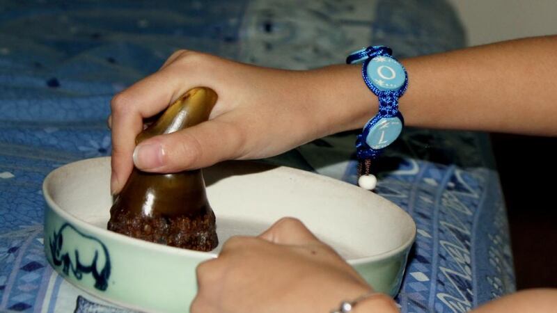 Cure-all?: a woman in Hanoi grinds  rhino horn into powder, which in Vietnam is believed to cure cancer. Photograph: AFP/Getty