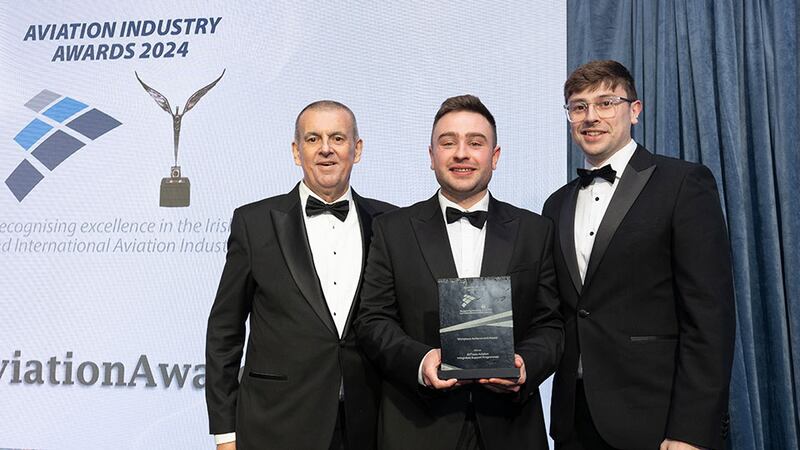 Ben Molloy, community lead at Business River, presents the workplace achievement award to Ken and Karl Fitzgibbon, Eirtrade Aviation