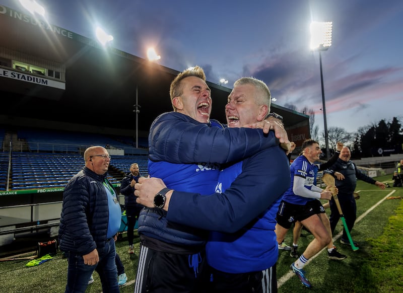 Sarsfields’ manager Johnny Crowley celebrates with Diarmuid O'Sullivan after their side's win over Ballygunner in the Munster final. Photograph: James Crombie/Inpho