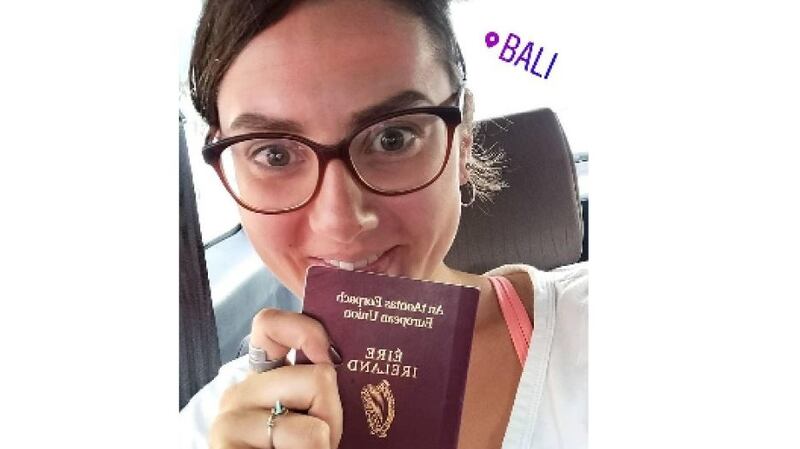 NUI Galway graduate Ciara Cremin takes a selfie  with her passport ahead of her long journey home.