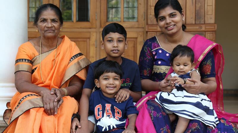 Bindu Jojo (right) with her children and mother Mary  at their house in Angamaly on the outskirts of Kochi City, Kerala. Photograph: Sivaram V