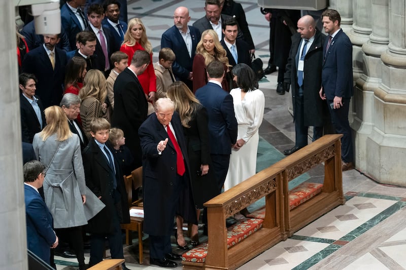 President Donald Trump gives a thumbs up as he and family members arrive for a service at the National Cathedral in Washington. Photograph: Doug Mills/The New York Times
                      