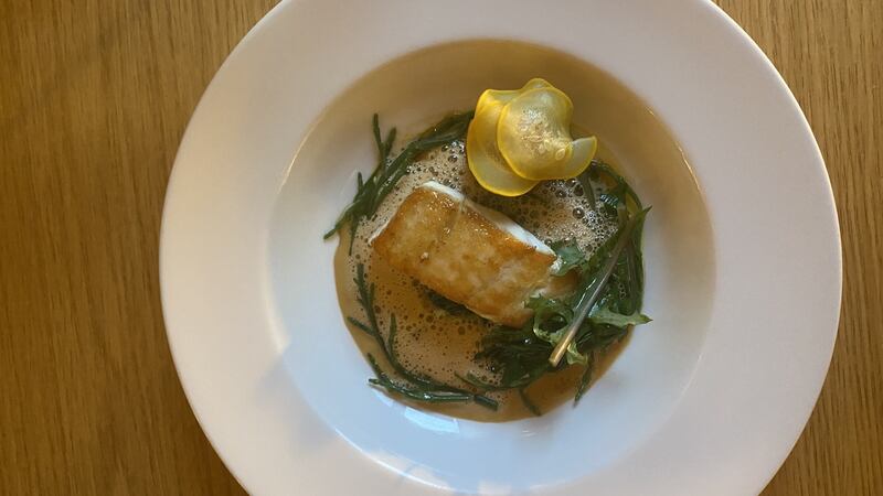 Hake with crab bisque on spinach and samphire with a seafood croquette.