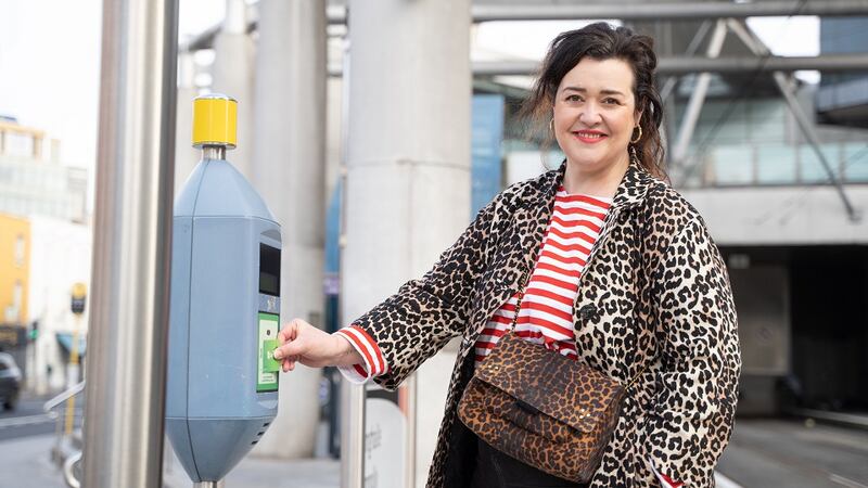 Kirstie taps on at Connolly Luas for her journey to Museum