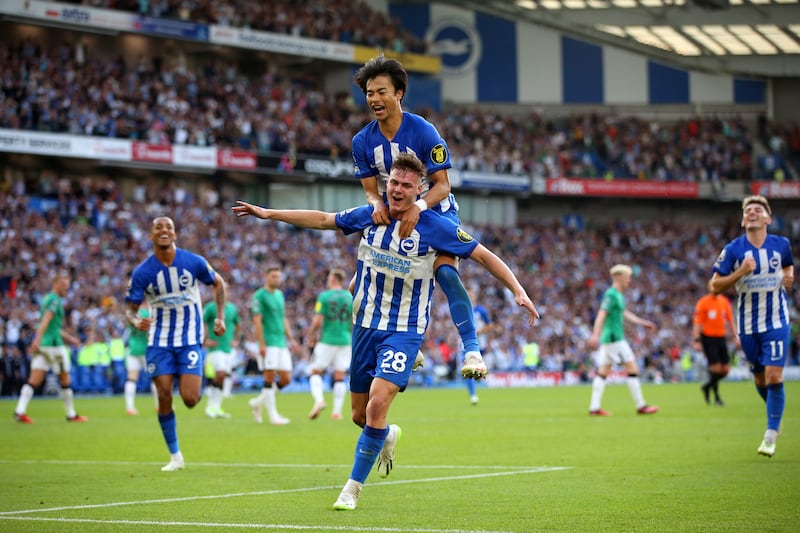 Ferguson celebrates with Brighton teammate Kaoru Mitoma after scoring his third goal against Newcastle United on September 2nd, 2023. Photograph: Steve Bardens/Getty