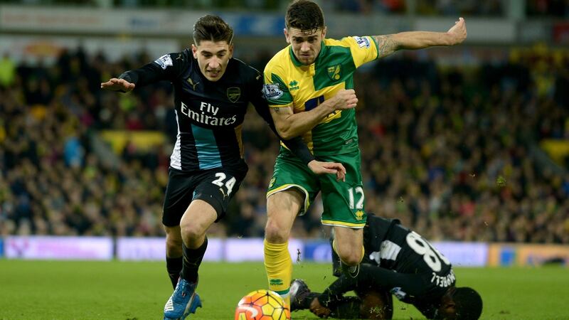 Arsenal’s Hector Bellerin and Norwich City’s Robbie Brady battle for the ball. Photograph: Adam Davy/PA