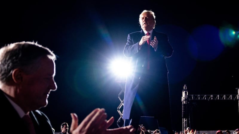 US president Donald Trump applauds as he departs a campaign event on behalf of Georgia’s Republican senators, Kelly Loeffler and David Perdue. Photograph: Erin Schaff/New York Times