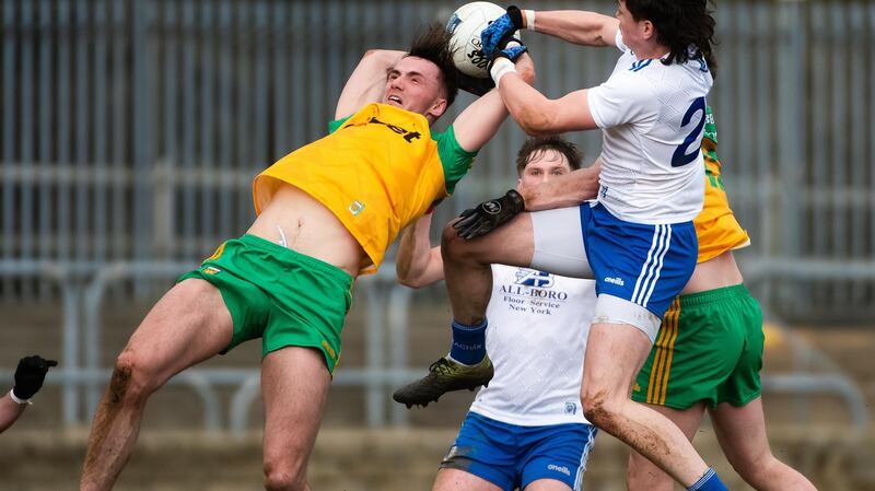 Donegal’s Jason McGee and Gary Mohan of Monaghan challenge for the ball  during the Allianz Football League Division One match at MacCumhaill Park in Ballybofey. Photograph: Evan Logan/Inpho