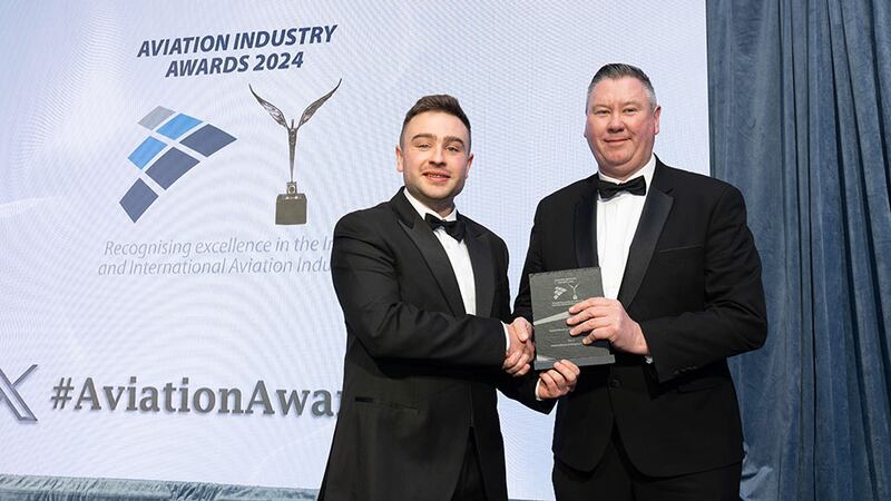 Ben Molloy, community lead at Business River, presents the apprenticeship programme award to John Mulqueen, EMEA of IAC