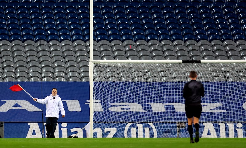 An umprire waves a red flag to signal a two-point score during the Interprovincial Series semi-final between Munster and Ulster last October. Photograph: James Crombie/Inpho