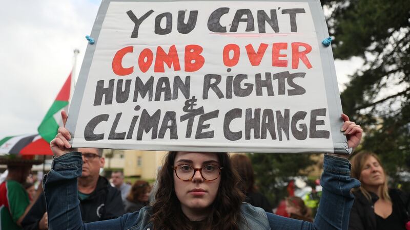 Protestors stand at the peace camp on the road to Shannon Airport following the arrival of US president Donald Trump for his visit to Ireland. Photograph: Brian Lawless/PA Wire.