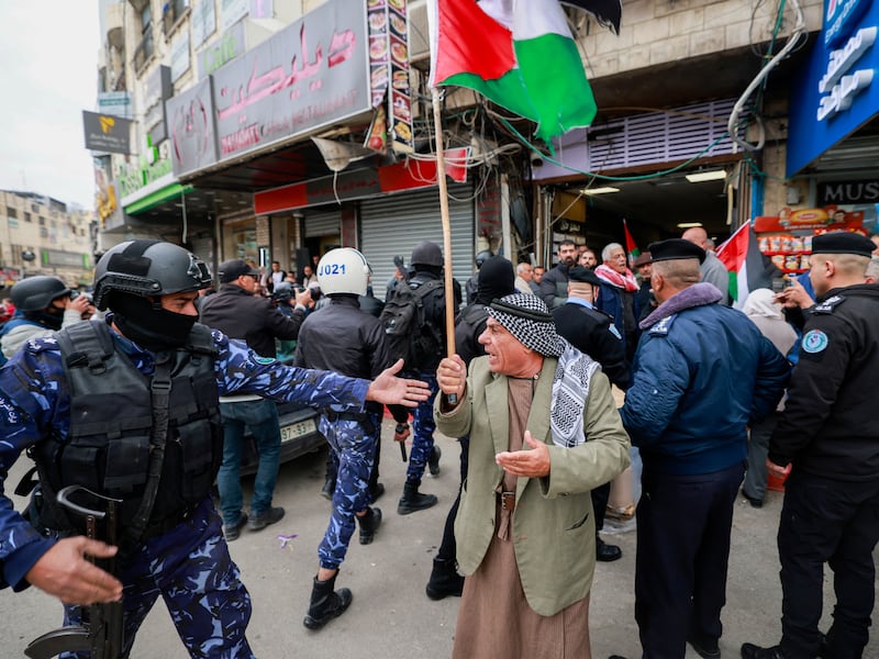 Police disperse demonstrators during a protest against clashes between Palestinian security forces and Palestinian militants in the northern occupied West Bank city of Jenin in recent days. Photograph: Jaafar Ashtiyeh/AFP/Getty