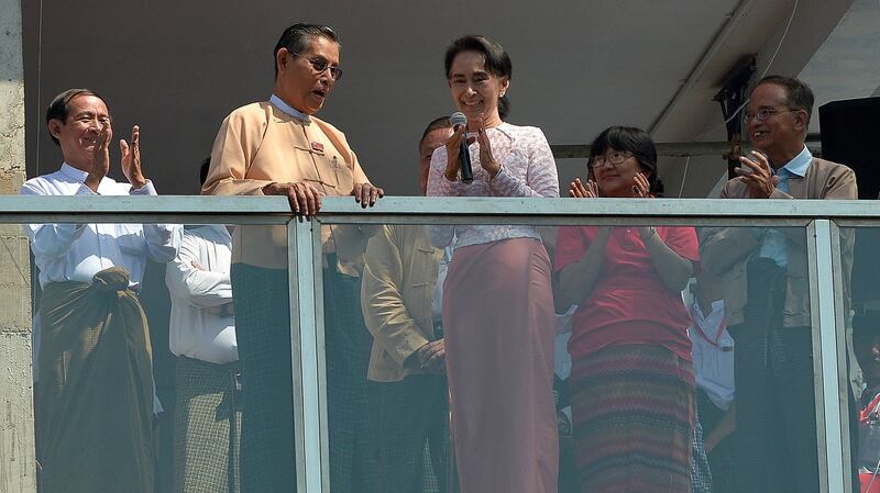 Aung San Suu Kyi, with other National League of Democracy officials, delivers a speech from the party’s headquarters following its election victory in November. Photograph: Phyo Hein Kyaw/AFP via Getty Images