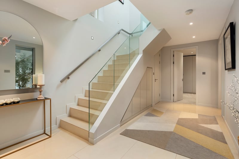 Hallway that leads up to the living and dining spaces