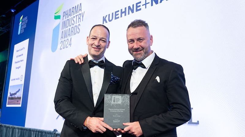 Victor Vargas, strategic lead at QuickStat A Kuehne+Nagel Company, presents the pharma contract services company of the year to Ger McCabe, Biostór Ireland