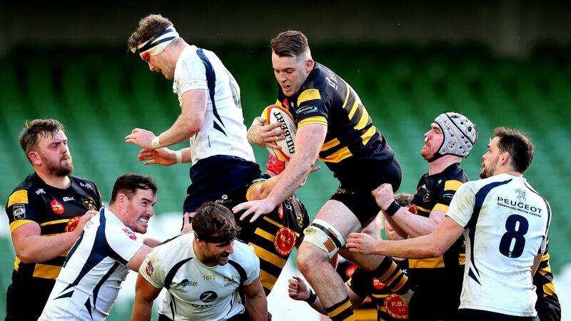 Tom Goggin of Young Munster claims the ball ahead of Lansdowne’s Jack O’Sullivan during the Energia All-Ireland League Division 1A game at the Aviva Stadium. Photograph: Ryan Byrne/Inpho