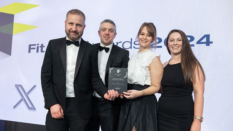 Karen O'Hara, head of sales and marketing of Ardmac, presents the fit out professional consultancy of the year award to Axiseng Consulting Engineers team