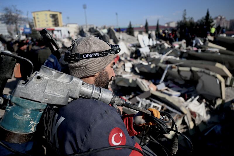 A rescue official in Kahramanmaras, Turkey. Photograph:  Ozan Kose/AFP via Getty Images