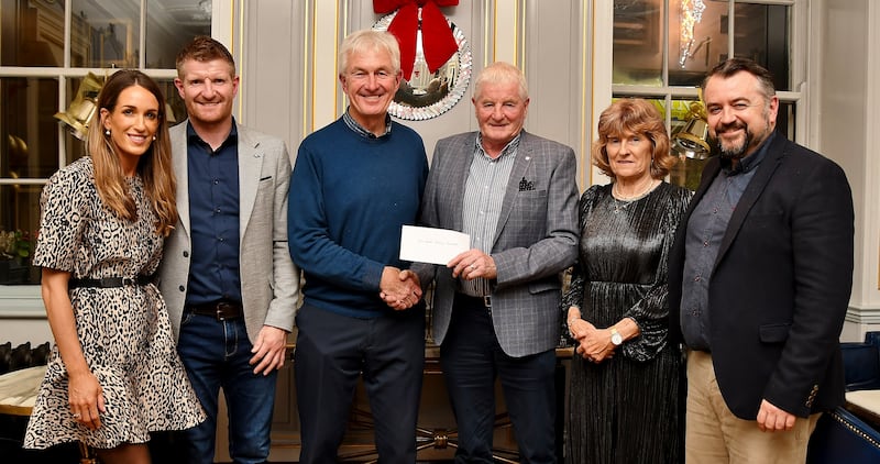 Bill Cuddihy, chairman of the Cois Nore Cancer Support Centre, receives a cheque for €3,500 from Richie Power Snr from the proceeds of Power, A Family Memoir. Also pictured are Maria Connolly, Richie Power Jnr, Ann Power and book author Dermot Keyes.