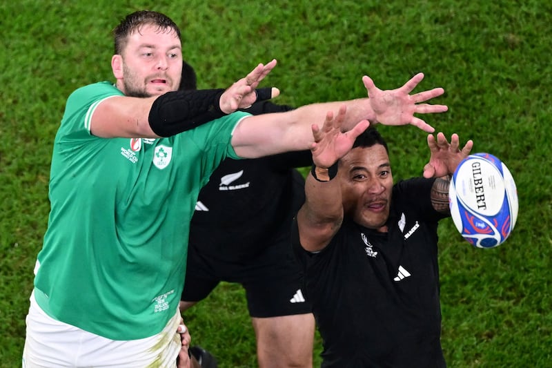 Ireland's lock Iain Henderson grabs the ball in a line out ahead of New Zealand's flanker Shannon Frizell during the France 2023 Rugby World Cup quarter-final match on October 14th, 2023. Photograph: Miguel Medina/AFP/Getty