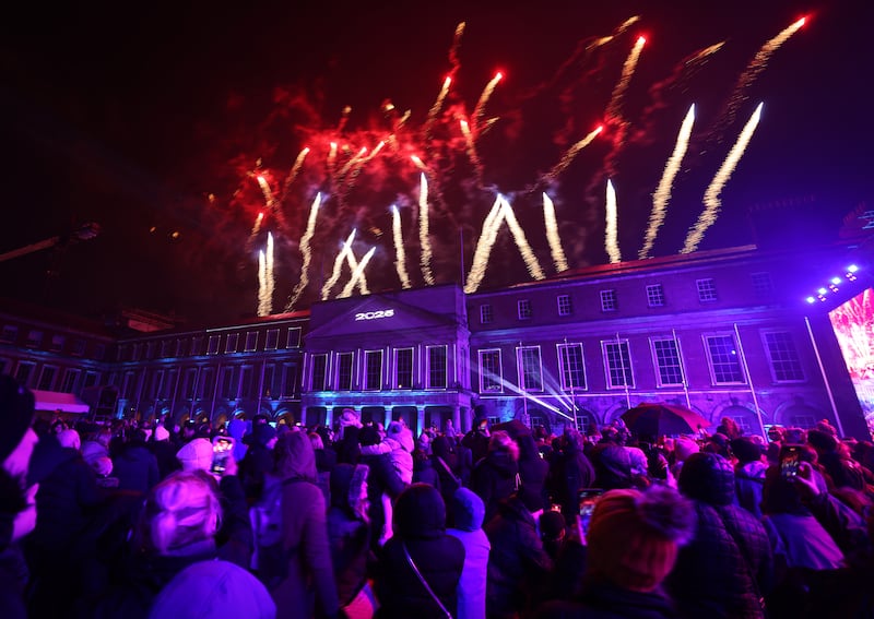 Families and friends gather at Dublin Castle on New Year’s Eve.
Photograph: Dara Mac Dónaill







