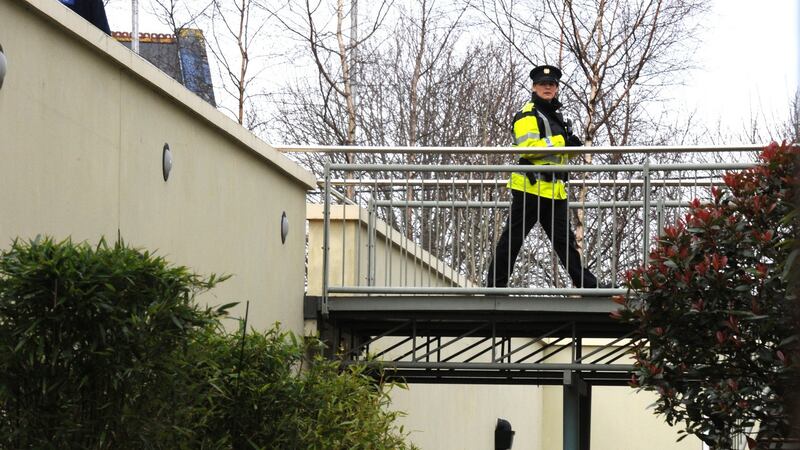 A garda is photographed at the scene where a child was found dead at the Park Place apartments in Killarney, Co Kerry on Sunday. Photograph: Domnick Walsh/Eye Focus.