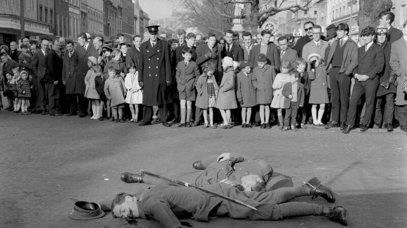 Crowds watch a scene from ‘Insurrection’ being filmed on O’Connell Street