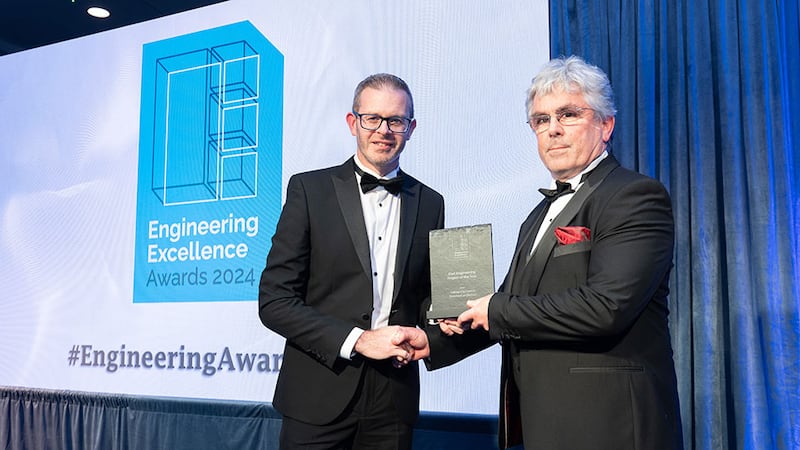 Niall Hanley, awards judge, presents the civil engineering project of the year award to Colm Ó Ríordáin, Galway City Council