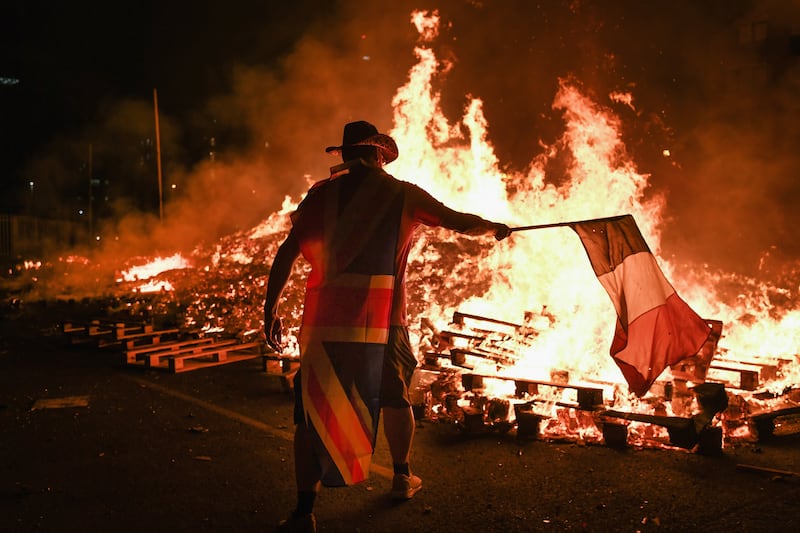 Loyalists gather in front of a bonfire on the Sandy Row area of Belfast on July 12th, 2017.  Photograph: Jeff J Mitchell/Getty Images