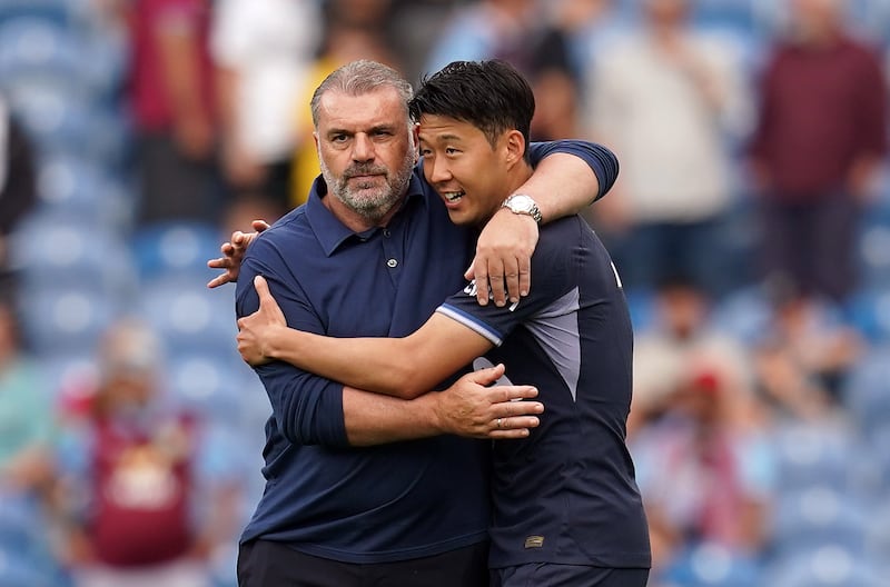 Tottenham Hotspur manager Ange Postecoglou congratulates Son Heung-min after the striker's hat-trick in the Premier League victory over Burnley at Turf Moor. Photograph: Nick Potts/PA Wire