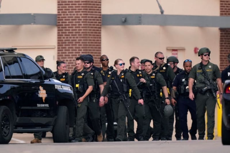 Law enforcement personnel responding to the incident. Photograph: AP