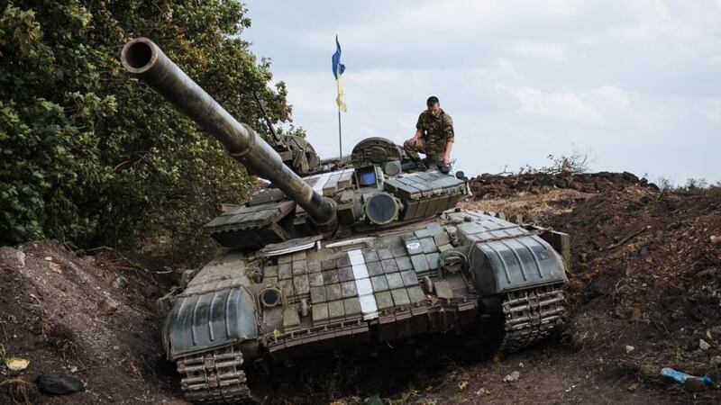 A Ukrainian soldier stands on a tank in a military camp, near the eastern Ukrainian town of Rassypnoe yesterday. Photograph: Roman Pilipey/EPA