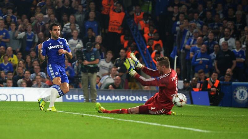 Cesc Fabregas scores for Chelsea against Schalke 04 in their  Uefa Champions League Group G match at Stamford Bridge. Photograph: Tony Marshall/PA Wire