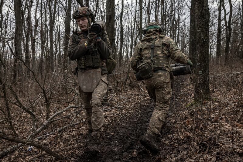 Members of a Ukrainian artillery crew move shells on the frontline in the Donetsk region of Ukraine on December 28th last. Photograph: Finbarr O’Reilly/New York Times
                      