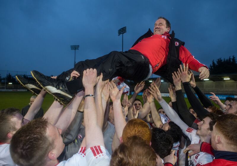 Tyrone players celebrate with Feargal Logan after the team defeated Tipperary in the All-Ireland Under 21 final at Parnell Park, Dublin, in May 2015. Photograph: Cathal Noonan/Inpho